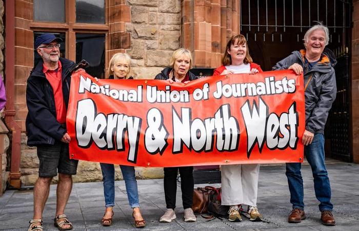 Derry & North West branch holding banner at vigil for journalists killed in Gaza