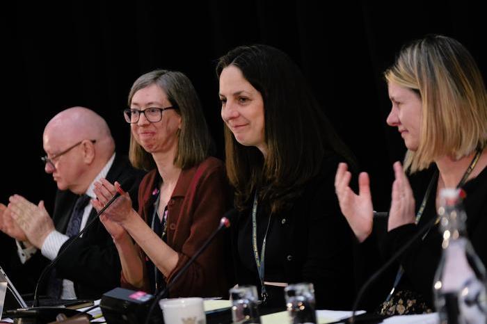 Natasha Hirst, NUJ president, wearing a black blazer opens DM 2025 alongside Seamus Dooley, Laura Davison, and Debbie Cavaldoro.