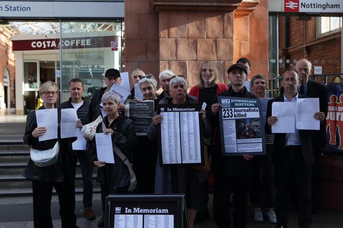NUJ members gathered outside Nottingham Railway Station in vigil for journalists killed in Gaza conflict